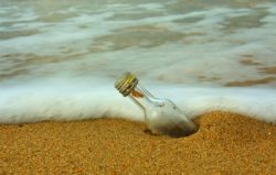 washed-up bottle on beach