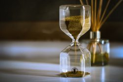 Hourglass with sand flowing from top to bottom