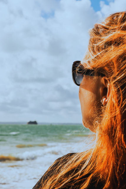 Image of Sophie Personne looking out to sea and reflecting